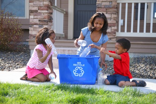 Workers managing construction waste effectively